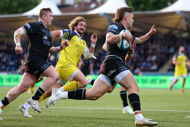 Kyle Rowe scores against Zebre Parma at Scotstoun, one of nine tries he got for Glasgow Warriors across last season's successful URC campaign. (Photo by Ross MacDonald / SNS Group)