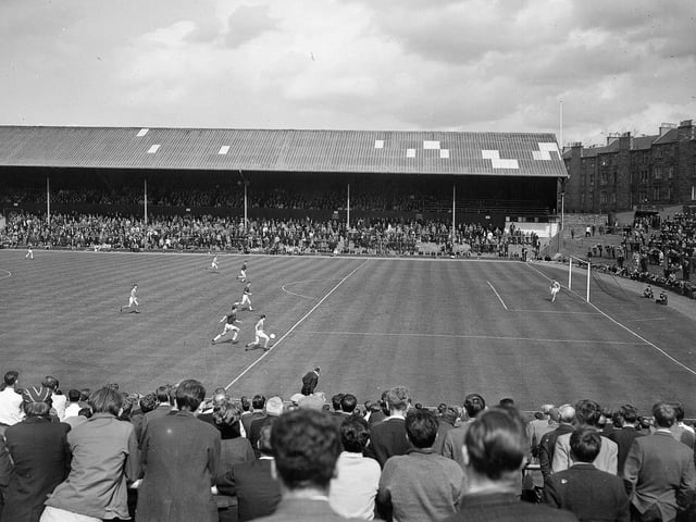 Crowds watch Hearts take on Kilmarnock at Tynecastle in June 1965, with a view of the recently-extended 18-yard line.