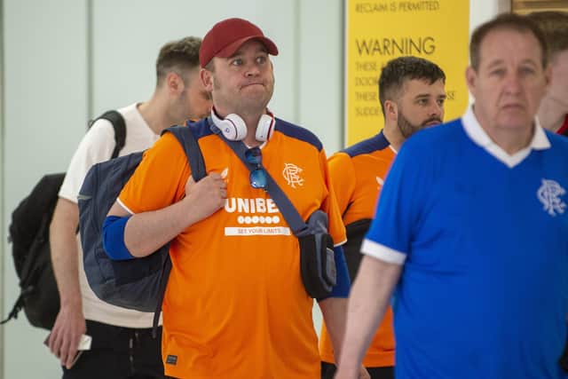 Feeling down but with their heads held high after lavish praise for their behaviour in Seville, Rangers fans arriving home after seeing their side lose in Spain.
Pic: Lisa Ferguson