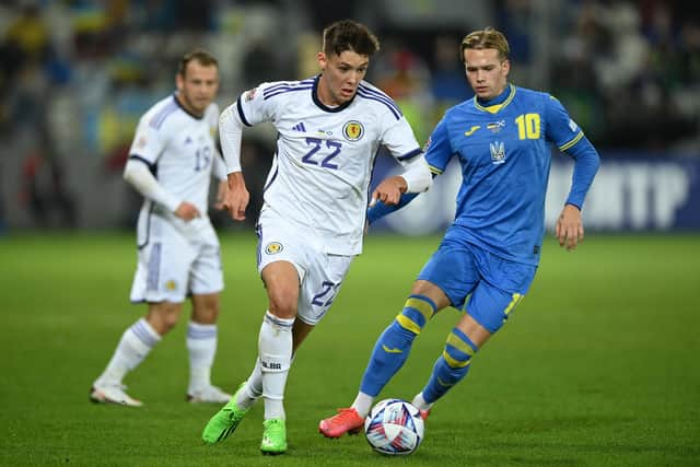 Scotland's Aaron Hickey (left) and Ukraine's Mykhailo Mudryk battle for the ball.