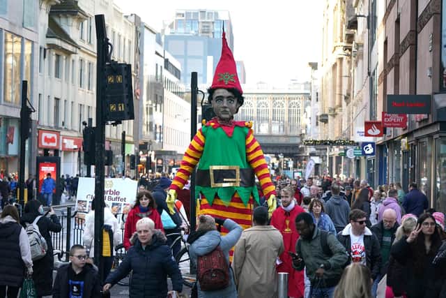 Festive shoppers in Glasgow where there was a modest year-on-year rise in footfall in December.