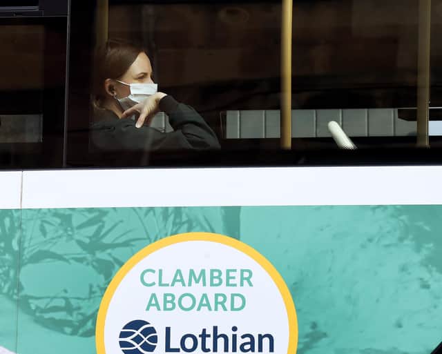 A passenger wearing a face covering on a Lothian bus. Picture: Lisa Ferguson.