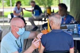 A member of the public receives a Covid vaccination at a car park in Glasgow (Picture: Jeff J Mitchell/Getty Images)