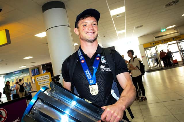 George Horne with the URC trophy after Glasgow Warriors landed back at Glasgow Airport from South Africa following the win over Vodacom Bulls in the final. (Photo by Ewan Bootman / SNS Group)