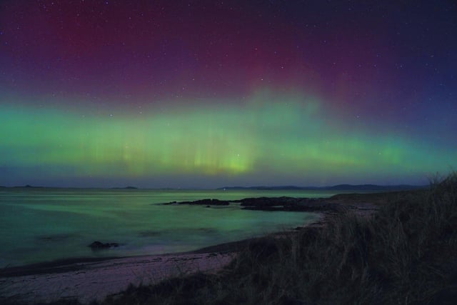 Handout photo taken with permission from the twitter account of @itshannahlclose of the northern lights over the Hebrides in Scotland. Picture date: Monday February 27, 2023.