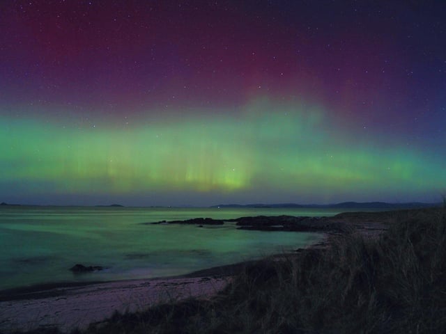 Handout photo taken with permission from the twitter account of @itshannahlclose of the northern lights over the Hebrides in Scotland. Picture date: Monday February 27, 2023.