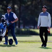 Jordan Brown makes his way down the 18th fairway with caddie Stuart Syme in the opening round of the Loch Lomond Whiskies Scottish PGA Championship at Scotscraig. Picture: Kenny Smith/Getty Images.