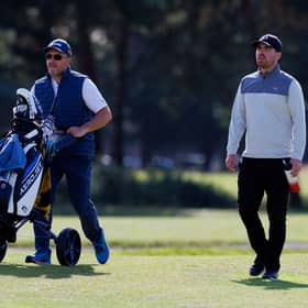 Jordan Brown makes his way down the 18th fairway with caddie Stuart Syme in the opening round of the Loch Lomond Whiskies Scottish PGA Championship at Scotscraig. Picture: Kenny Smith/Getty Images.