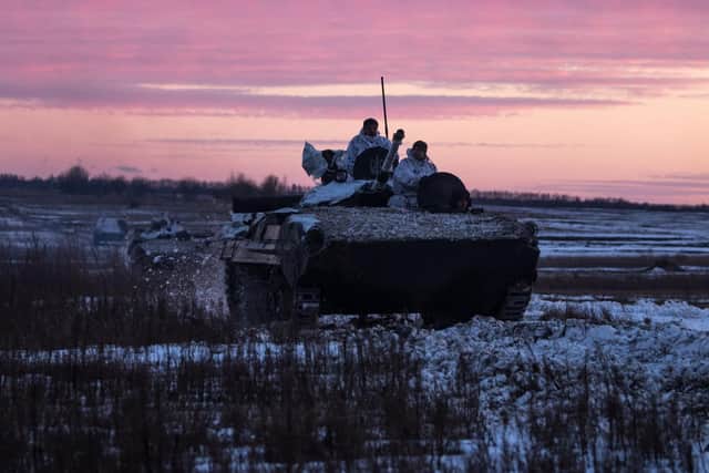 This handout picture taken and released by the press-service of General Staff of the Armed Forces of Ukraine shows Ukrainian servicemen making 200-kilometres day-night-day march as part of combat training in Chernihiv region on February 12, 2022. Via Getty