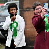 Members of the Scottish Green Party stand outside a polling station at Notre Dame Primary School in Glasgow as voters elect a new Holyrood Parliament (Picture: Jeff J Mitchell/Getty Images)