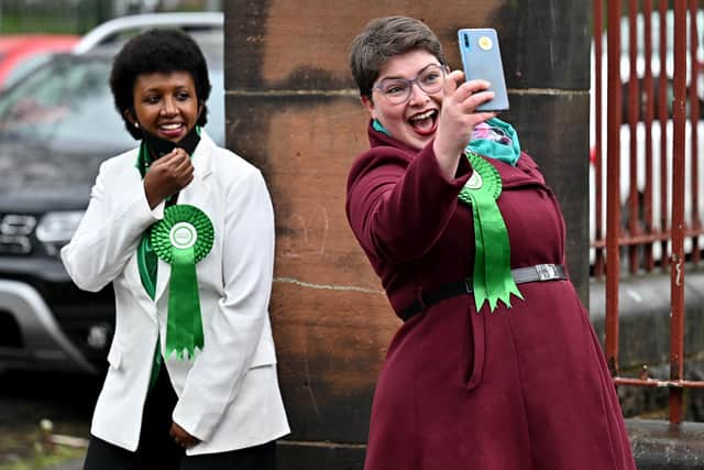 Members of the Scottish Green Party stand outside a polling station at Notre Dame Primary School in Glasgow as voters elect a new Holyrood Parliament (Picture: Jeff J Mitchell/Getty Images)