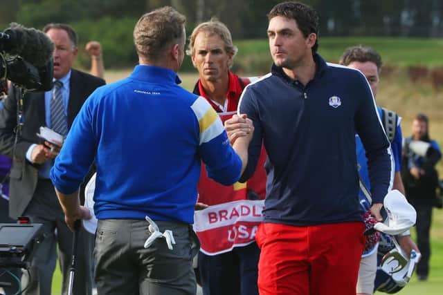 Keegan Bradley, right, shakes hands with Jamie Donaldson after their singles match in the 2014 Ryder Cup at Gleneagles. Picture: Ross Kinnaird/Getty Images.