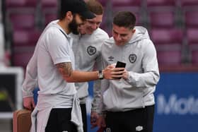 Kye Rowles, centre, and Cammy Devlin, right, are two of three Hearts players called up for the World Cup.