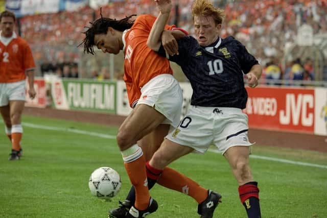 Ruud Gullit  holds off Stuart McCall during the European Championship group  match in Gothenburg back in 1992 (Credit: Simon Bruty /Allsport)
