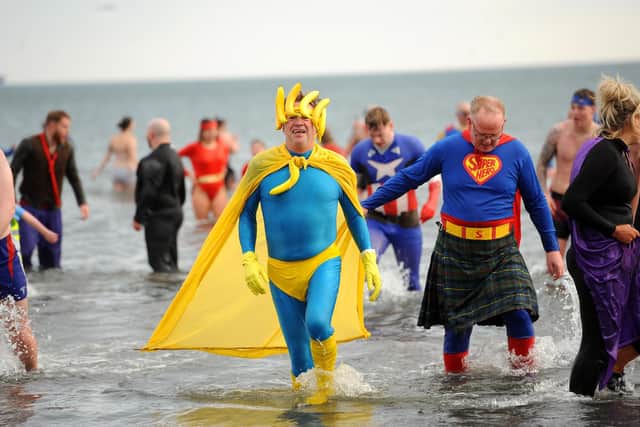 The new year's day loony dook on January 1, 2020 at Kirkcaldy beach - the event had a superhero theme. Pic: Fife Photo Agency.