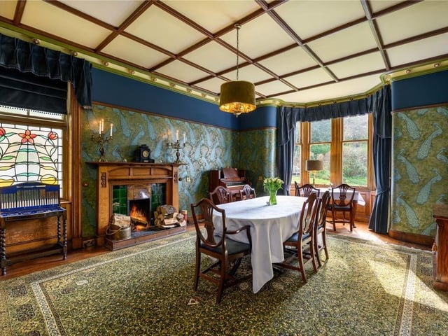 The dining room is a successful mix of contemporary and traditional, with a large window, open fire and a welcoming atmosphere.