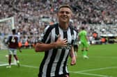 Harvey Barnes celebrates after scoring on his Newcastle debut against Aston Villa. (Photo by IAN HODGSON/AFP via Getty Images)