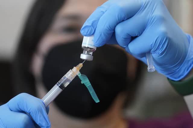 A registered nurse prepares a dose of a monkeypox vaccine (AP Photo/Rick Bowmer, File)