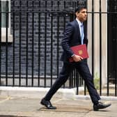 Chancellor Rishi Sunak leaves Downing Street on Thursday