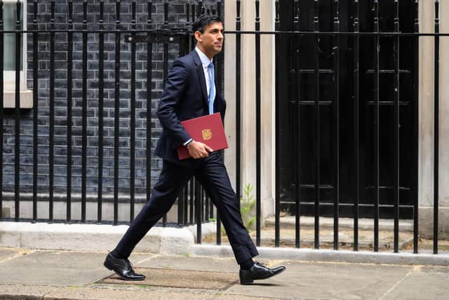 Chancellor Rishi Sunak leaves Downing Street on Thursday