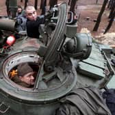 A captured Russian tank is repaired by Ukrainian forces in the Kharkiv region (Picture: Anatolii Stepanov/AFP via Getty Images)