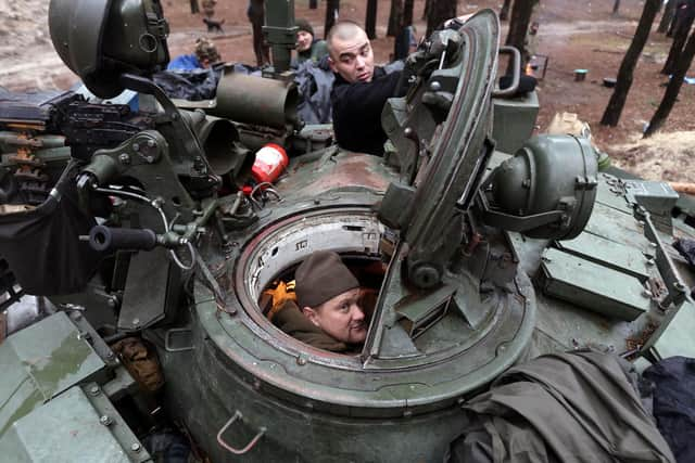 A captured Russian tank is repaired by Ukrainian forces in the Kharkiv region (Picture: Anatolii Stepanov/AFP via Getty Images)