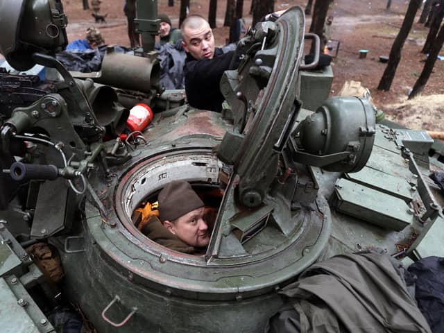 A captured Russian tank is repaired by Ukrainian forces in the Kharkiv region (Picture: Anatolii Stepanov/AFP via Getty Images)