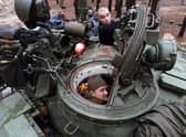 A captured Russian tank is repaired by Ukrainian forces in the Kharkiv region (Picture: Anatolii Stepanov/AFP via Getty Images)