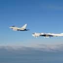 A RAF Typhoon monitoring a Russian Tupolev Tu-142 maritime reconnaissance and anti-submarine warfare (ASW) aircraft. Picture: MoD/Crown Copyright/PA Wire