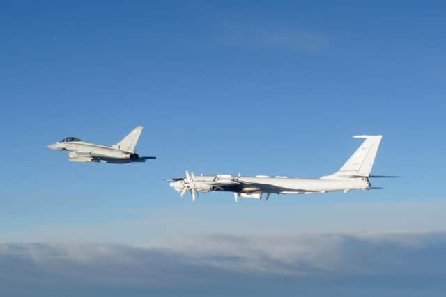 RAF Typhoon monitoring a Russian Tupolev Tu-142 maritime reconnaissance and anti-submarine warfare (ASW) aircraft. Picture: MoD/Crown Copyright/PA Wire