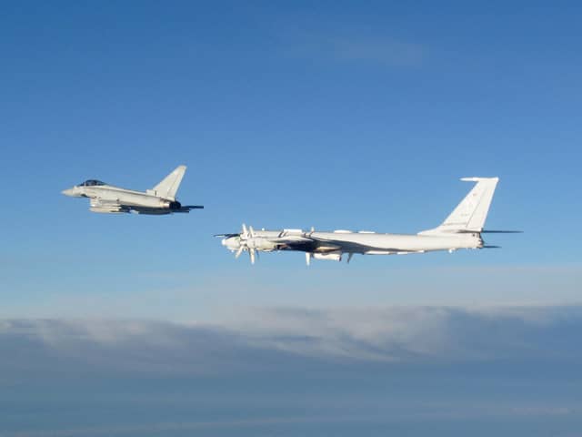 A RAF Typhoon monitoring a Russian Tupolev Tu-142 maritime reconnaissance and anti-submarine warfare (ASW) aircraft. Picture: MoD/Crown Copyright/PA Wire