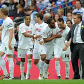 Stephen Dobbie celebrates with Swansea manager Brendan Rodgers having scored their third goal in a 4-2 win over Reading in the Championship Play-off final at Wembley. Photo by Dan Rowley/Shutterstock (7442650ad)