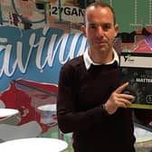 Martin Lewis with the book, which has been developed to help schools deliver a holistic programme of financial education. Picture: contributed.