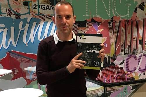 Martin Lewis with the book, which has been developed to help schools deliver a holistic programme of financial education. Picture: contributed.