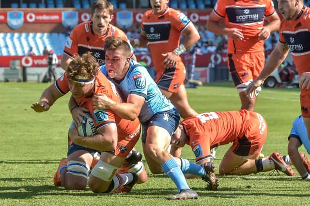 Edinburgh's Hamish Watson is hauled down just short of the Bulls tryline at Loftus Versfield. Photo by David Gibson/Fotosport/Shutterstock