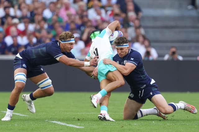 Scotland's Jamie Ritchie, left, and Rory Darge, right, combine to stop South Africa's wing Cheslin Kolbe during the Rugby World Cup. Darge will replace Ritchie for the Six Nations match against France. (Photo by PASCAL GUYOT/AFP via Getty Images)