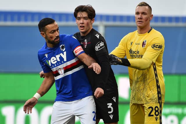 Fabio Quagliarella of UC Sampdoria with Aaron Hickey and Lukasz Skorupski of Bologna FC during the Serie A match between UC Sampdoria and Bologna FC at Stadio Luigi Ferraris on November 22, 2020 in Genoa, Italy. (Photo by Paolo Rattini/Getty Images)
