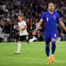 Harry Kane of England celebrates after scoring their team's first goal from the penalty spot during the UEFA Nations League League A Group 3 match between Germany and England at Allianz Arena in June. (Photo by Martin Rose/Getty Images)