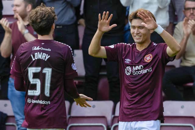 Hearts' summer signings Kyosuke Tagawa and Alex Lowry celebrate after they combined to wrap up their 4-0 Viaplay Cup victory over Partick Thistle and book a place in the quarter-finals. Photo by Mark Scates / SNS Group