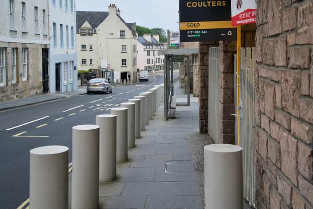 Bollards and bus stops obstructing the pavement near the foot of Canongate. Picture: Living Streets Scotland