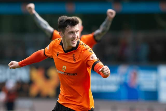 Dundee United's Jamie McGrath celebrates after making it 1-0 against Livingston - although he later came off injured.