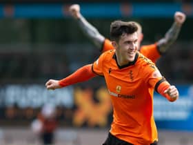 Dundee United's Jamie McGrath celebrates after making it 1-0 against Livingston - although he later came off injured.