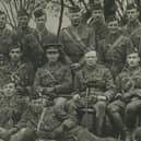 Lieutenant-Colonel Winston Churchill, seated centre wearing a Glengarry bonnet, and Andrew Dewar Gibb, also in a Glengarry, pose for a picture with other officers during the First World War