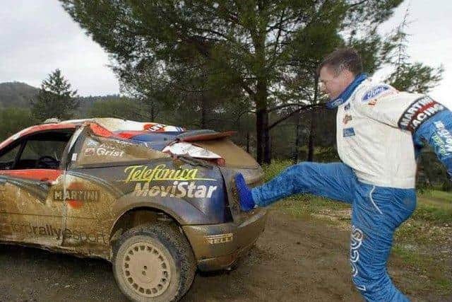 McRae does some DIY bodywork repairs after another smash in the Ford.