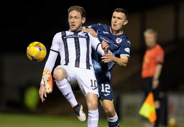 Dunfermline's Declan McManus (left) holds off Raith's Ross Matthews during the recent league meeting between the sides, which Raith won 5-1. (Photo by Ross Parker / SNS Group)