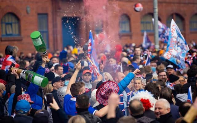 Rangers fans gather outside Ibrox as they are crowned champions on March 07, 2021, in Glasgow, Scotland. (Photo by Alan Harvey / SNS Group)