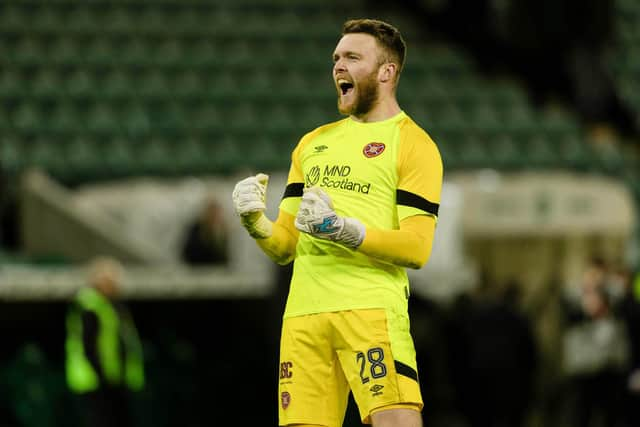 Clark celebrates in front of the travelling Hearts support.