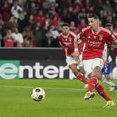 Benfica's Angel Di Maria scores his side's first goal from the penalty spot against Rangers.