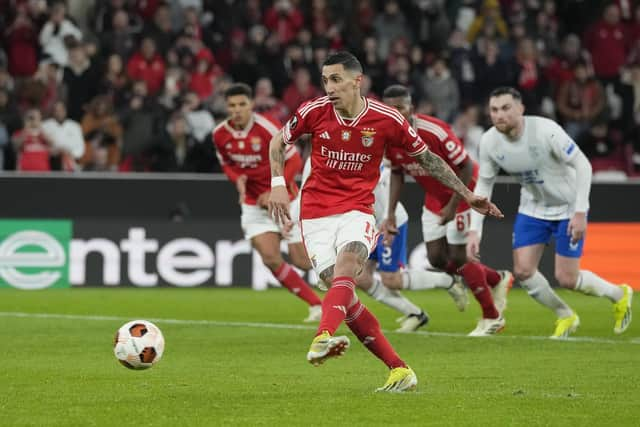 Benfica's Angel Di Maria scores his side's first goal from the penalty spot against Rangers.