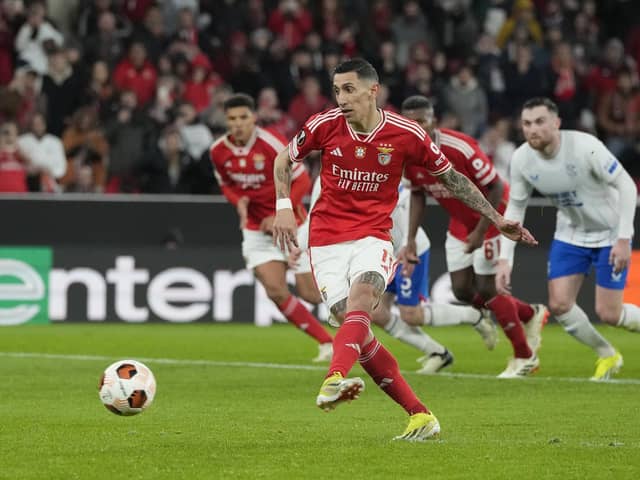 Benfica's Angel Di Maria scores his side's first goal from the penalty spot against Rangers.